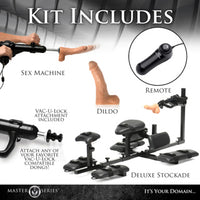 Sex machine kit with components labeled including a dildo, Remote, and Deluxe Stockade.