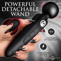 Black detachable wand with remote control held by a hand, featuring text on patterns and speeds.
