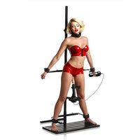 Person wearing a red outfit on a mechanical device against a white background