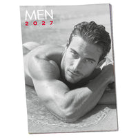 man laying in the water at  beach on calendar cover