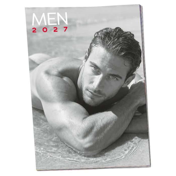 man laying in the water at  beach on calendar cover