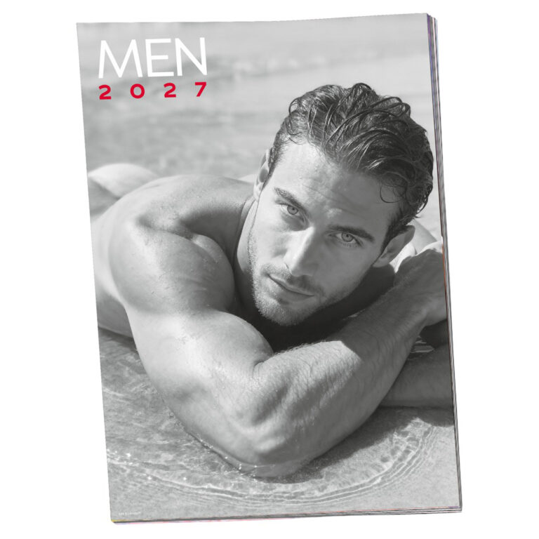 man laying in the water at  beach on calendar cover