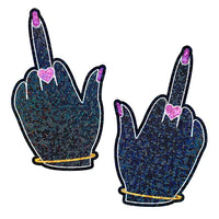 females hands with middle finger, pink nails and heart ring on middle finger pasties
