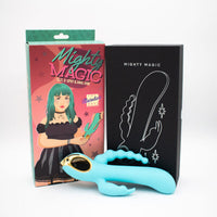 Turquoise vibrator with clitoral stimulator with packaging and black box featuring 'Mighty Magic' branding.