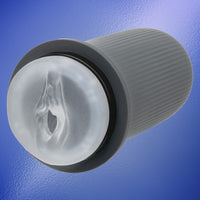 grey and clear vagina masturbator on blue back ground