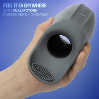 grey masturbator with ball rubber held in hand