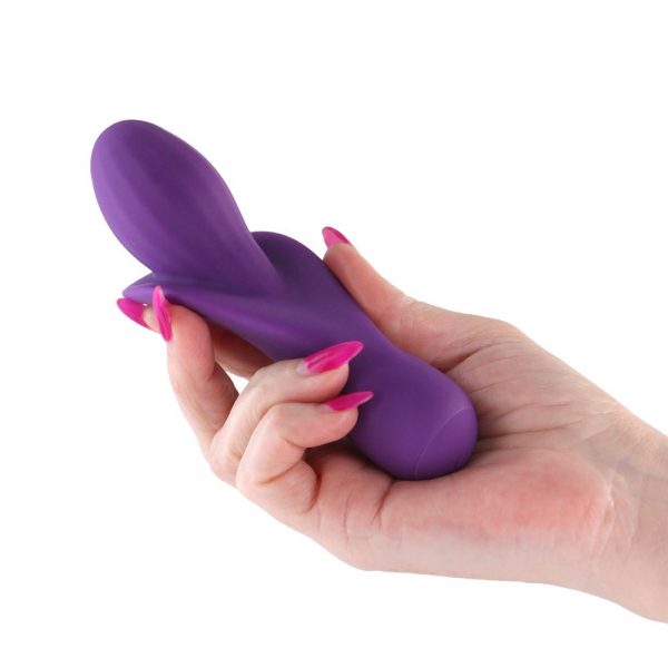 Hand holding a Purple millie vibrator on a white background