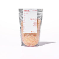 Package of mineral bath salts with a white label on a white background