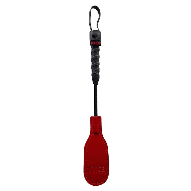Red paddle with black handle on a white background
