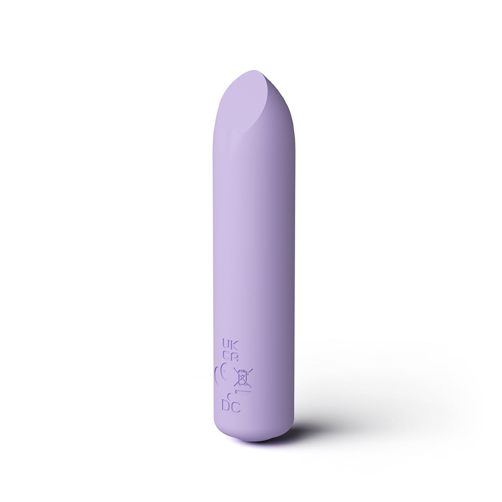 A lavender purple curved silicone personal care device, standing vertically on a white background with a soft shadow.