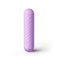 A lavender purple textured silicone personal massager with a rounded, elongated cylindrical shape, standing vertically on a white background with a soft shadow.