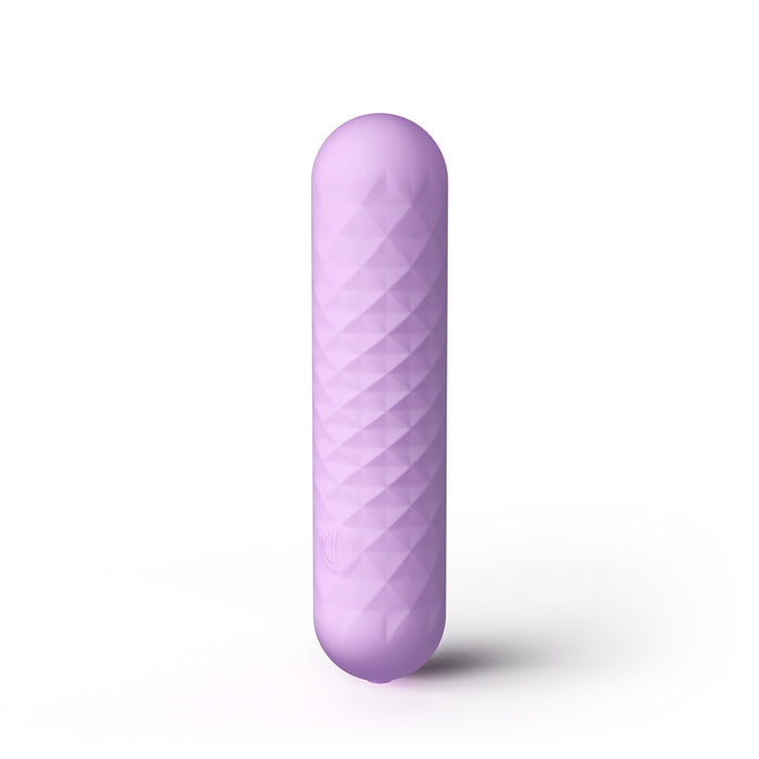 A lavender purple textured silicone personal massager with a rounded, elongated cylindrical shape, standing vertically on a white background with a soft shadow.