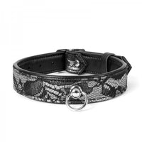Black and silver patterned collar with a silver buckle on a white background