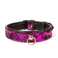 Black and pink patterned collar with a silver buckle on a white background