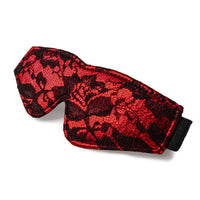 Red and black patterned eye mask product on a white background