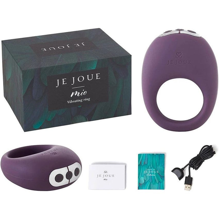 purple rechargeable vibrating silicone cock rings with charging cord and information booklets next to je joue box
