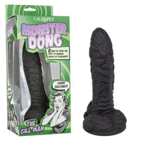 Black textured dildo resembling a creature with 'Monster Dong' packaging on a white background