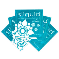 Multiple packages of sliquid natural sea intimate lubricant on a white background