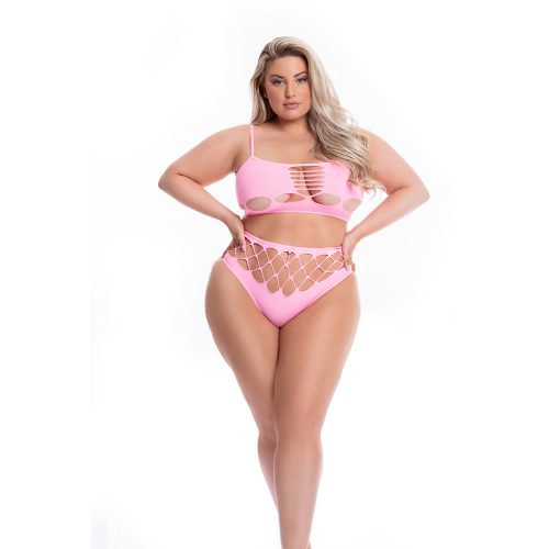 Woman wearing a pink bikini with cut-out design on a white background