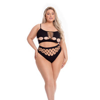 Woman wearing a black bikini with cut-out design on a white background