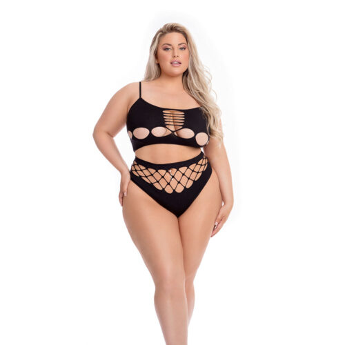 Woman wearing a black bikini with cut-out design on a white background