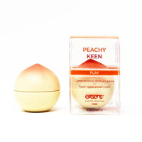 Peach-shaped cream with packaging labeled 'Peachy Keen' on a white background