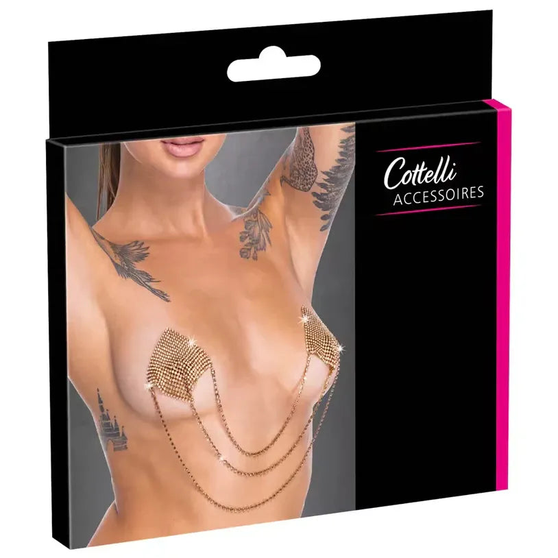 Package of Cottelli accessories with a model wearing gold square nipple stickers with chains on a gray background