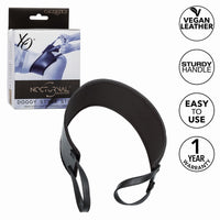 black doggy style support positioning strap beside packaging