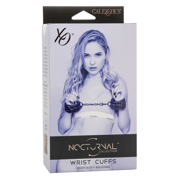 female wearing black leahter wrist cuffs on box