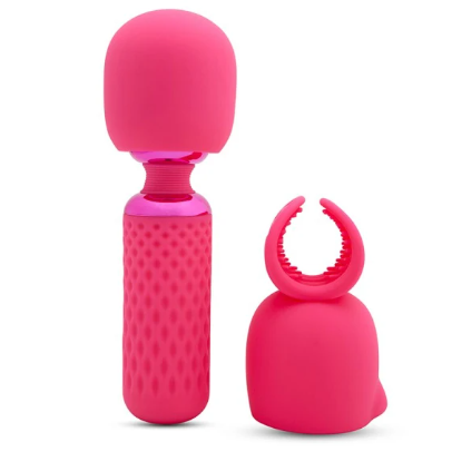 Pink silicone massage with attachment with textured design on a white background