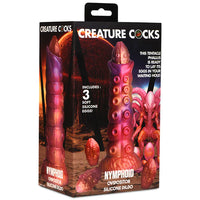 Box of 'Creature Cocks' product with tentacle design and text on a white background