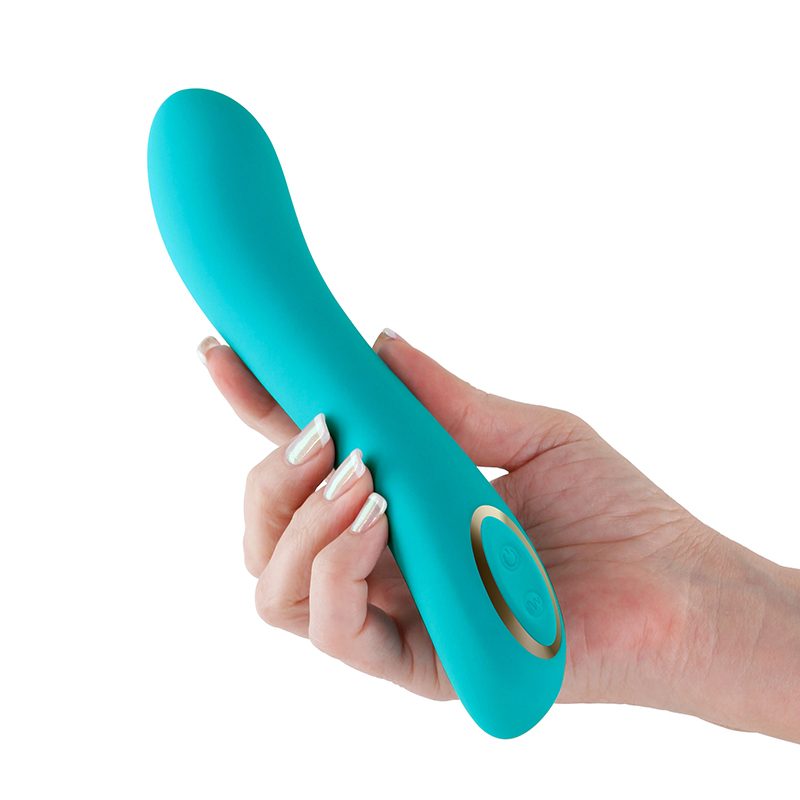 Turquoise vibrator held by a hand on a white background