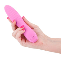 Hand holding a pink thrusting clyde vibrator against a white background