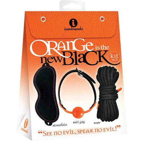 an orange display box that depicts a blindfold with orange stitching, an orange ball gag with a black strap and black rope 
