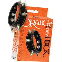 orange is the new black orange box with black leather spiked cock ring with snaps