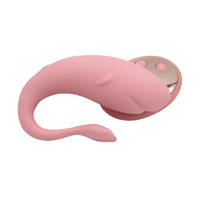 Pink and gold orca shape egg on a white background