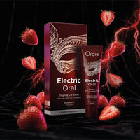 Orgie Electric Oral Tingling Lip Gloss in Strawberry flavor, shown with its retail box and a single tube. The packaging is dark red with a gold masquerade mask graphic.