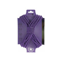 japanese bondage rope on carboard backing, rope displayed in the shape of an x . in purple