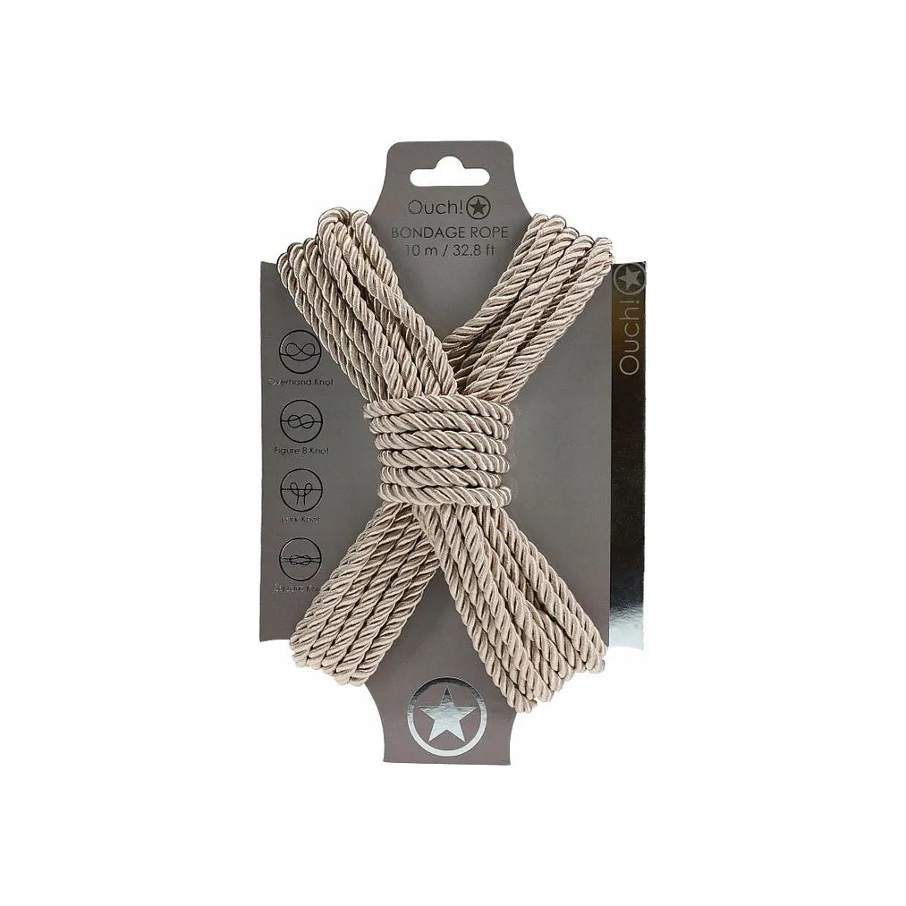 japanese bondage rope on carboard backing, rope displayed in the shape of an x . in gold