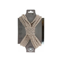 japanese bondage rope on carboard backing, rope displayed in the shape of an x . in gold