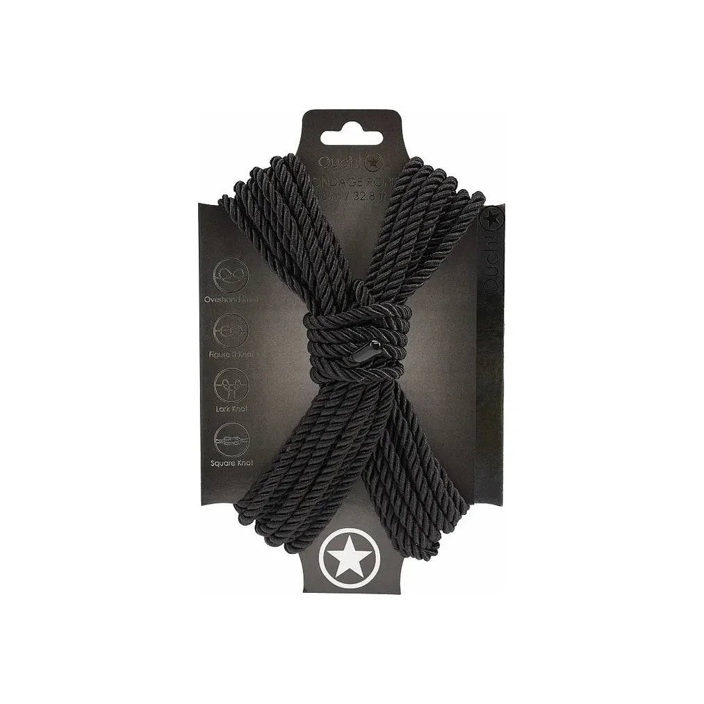 japanese bondage rope on carboard backing, rope displayed in the shape of an x . in black