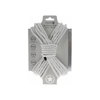 japanese bondage rope on carboard backing, rope displayed in the shape of an x . in silver