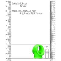 green cock ring and ball strap with measurements and compared to stick of lipstick