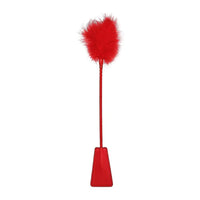 a red riding crop with a feathered end