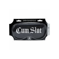 Satin blindfold with 'Cum Slut' text in packaging on a white background