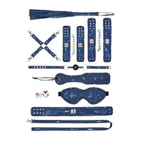 a blue denim and silver accented bondage kit that includes a flogger, a hog tie, cuffs, a ball gag, a paddle, a blindfold, a collar and a leash