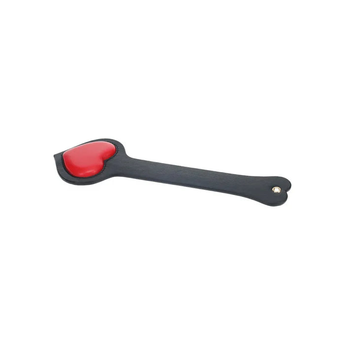 black paddle with raised red heart at bottom