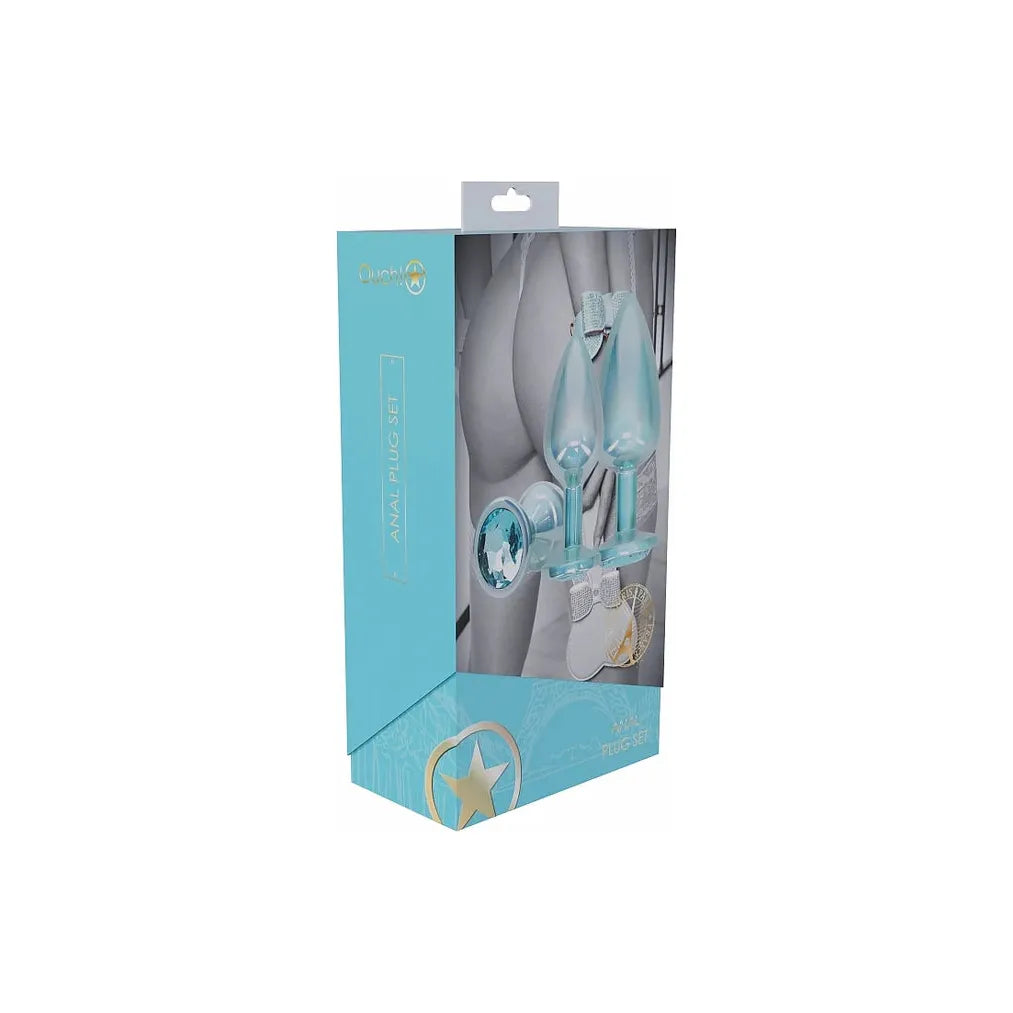 blue 3pc metal butt plugs with blue gem on bottom, on box packaging