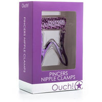 purple box with purple nipple clamps and chain inside