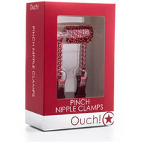 red nipple clamps connected by red chain inside red box